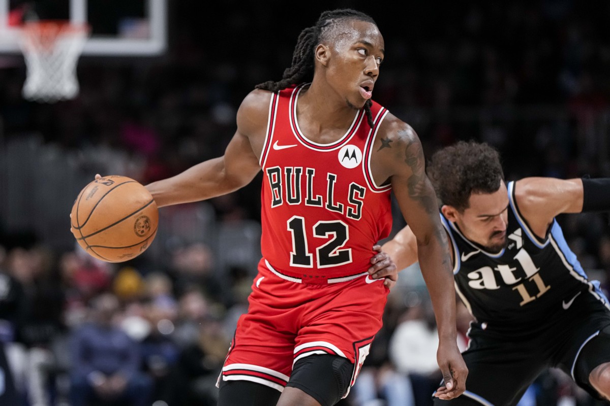 Chicago Bulls guard Ayo Dosunmu (12) is fouled by Atlanta Hawks guard Trae Young (11) during the second half at State Farm Arena.